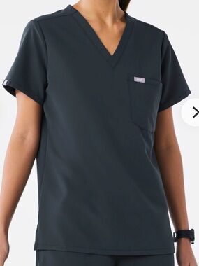 FIGS Catarina scrub top deep gray color with a V-neck and a single chest pocket